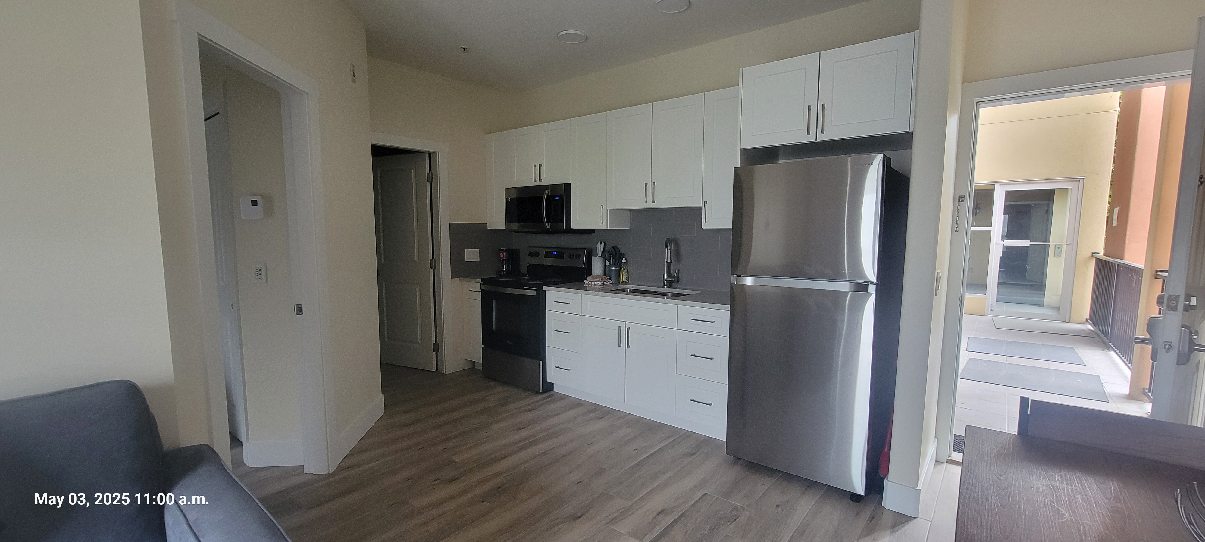 Alternate kitchen and dining view in the Deluxe 1 Bedroom suite